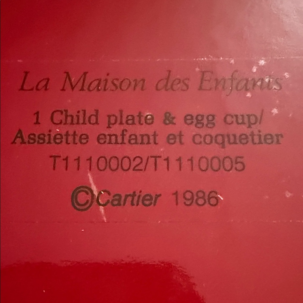 Cartier Red Child Plate and Egg Cup Set plus a cereal bowl and milk cup